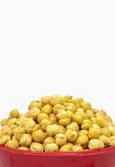 Closeup of Garbanzo Bean or Chickpea in a Red Bowl Isolated on White Background, Also Known as Bengal Gram or Egyptian Pea in Vertical Orientation