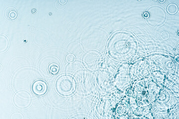 Gentle ripples form on a serene blue surface