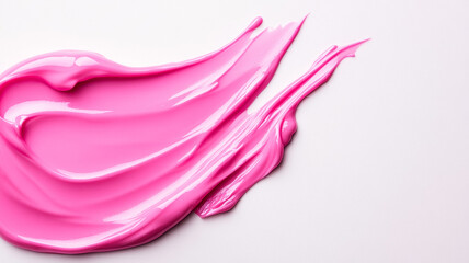 Milky pink cosmetic serum flowing down in silky streams against a white backdrop highlighting its light fluid texture 