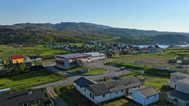 Aerial view rising in front of the Bug&oslash;ynes village, summer day in north Norway