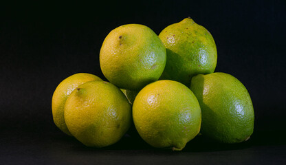 Lemons on black background.