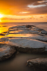 Obraz premium Sunset at Scala dei Turchi: The Iconic White Cliffs of Sicily