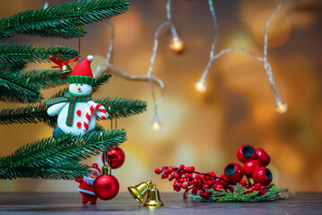 Gold Christmas background of de-focused lights with decorated tree