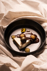 A creamy panna cotta topped with rich dark chocolate and a zesty citrus jam. This elegant dessert...