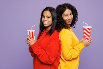 Side view two young fun little happy kid teen girls women they wear red yellow hoodie casual...