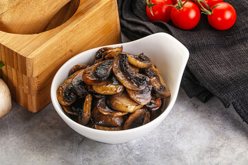 Roasted champignon mushrooms in the bowl