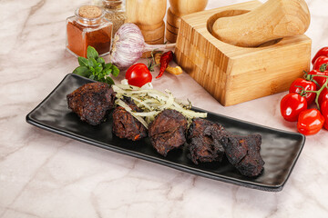 Grilled beef barbecue served onion