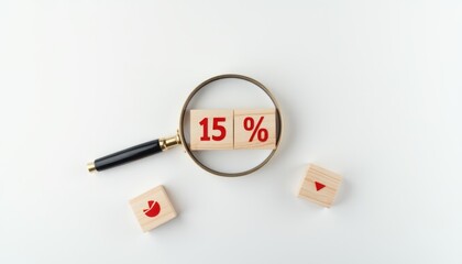 A magnifying glass focusing on a dice showing a 15 discount, surrounded by other small dice on a white surface.