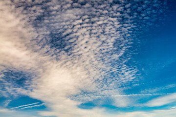 Blue sky with small clouds