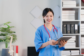 Confident Female Doctor using Tablet 