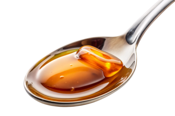 A shiny spoon holding a thick, amber-colored drizzle of honey, capturing the golden hues and viscous texture, ready to sweeten any dish, on a transparent background