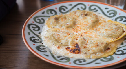 Italian plate of pasta served on restaurant. Classic italian cuisine dish. Popular italian food.