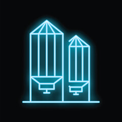 Blue neon sign of grain silos for agricultural storage on a black background © ylivdesign
