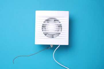 Ventilation hood fan on a blue background.