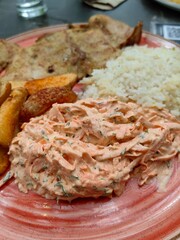 Home made food with slice of pork , rice and mash potato.