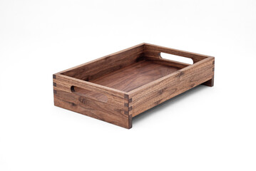 Solid walnut wood tray with dovetail joints and cutout handles on the sides for easy carrying on white background