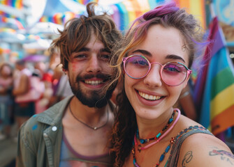 Fototapeta premium Smiling young couple at a pride festival with rainbow flags and vibrant decorations, sharing a joyful moment together.