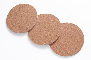 Cork coasters for drinks on a white background