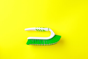 Cleaning brush  on color background. Brush for cleaning clothes, carpets. Tool for home care.- Image