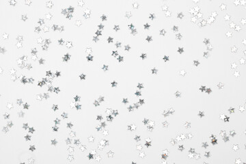 sparkles silver stars on white background with text place- Image