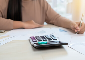 businessman sitting at desk holds pen signing contract paper, lease mortgage, employment hr or affirm partnership 