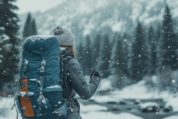 Fototapeta premium Portrait of explorer woman near the glacier with backpack, Selective focus man with sweater, trekking poles and backpack near the river with pine tree, Backpacker walking to the snow forest.