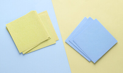 Blue and pink memo square papers on pastel background. Template for design