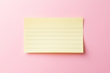 Blank yellow notepad on a pink background for notes.