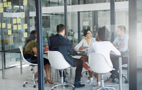 Business people, meeting and teamwork with planning in office, brainstorming and feedback for project. Employees, consultant or coworkers with review, communication or development for company or talk