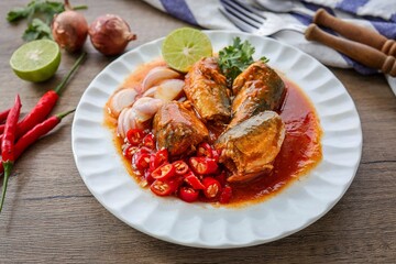 Mackerel in tomaro sauce ,Spicy Canned Mackerel salad, canned fish,Tinned fish in a white plate, 