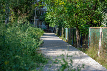 The sidewalk is paved with stone.
Odessa Cheremushki. The pedestrian path is paved with paving...