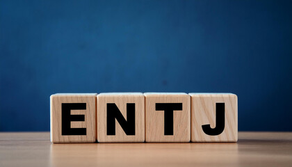 Wooden cubes with abbreviation ENTJ. Extraverted, Intuitive, Thinking, Judging. Personality type.