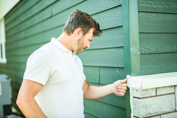 inspector or engineer is checking the building structure and house. After the renovate is complete