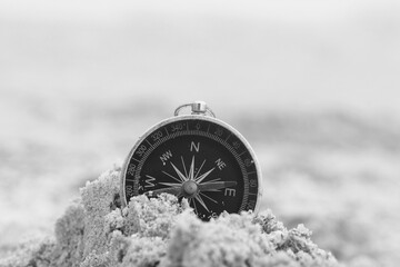 Classic navigation compass on natural background