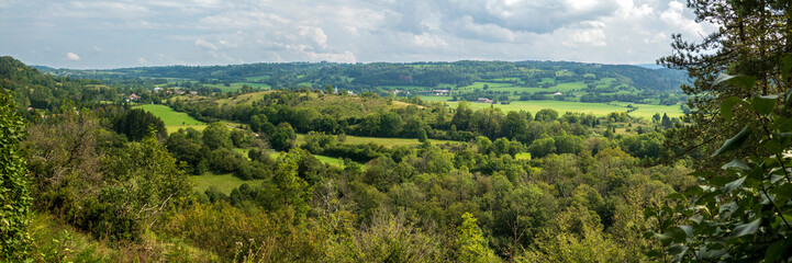 Obraz premium Panoramic view over the Ain valley near Sirod in the French Jura in summer