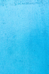 A vibrant blue textured background with a rough, grunge surface. Ideal for design projects, backdrops, and creative visual elements. Offers a minimalist yet striking appearance.