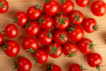 Cherry tomatoes on a wooden cutting board