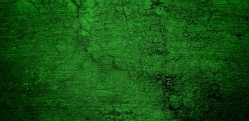 Fototapeta premium the long wall background is green, blank uncoated canvas or scrim for background long and wide panoramic banner background from rough linen dark green cloth or burlap