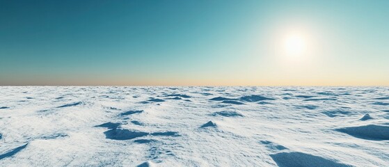 Fototapeta premium Expansive view of a serene snow-covered landscape under a clear blue sky, showcasing the beauty of winter and the tranquility of nature.
