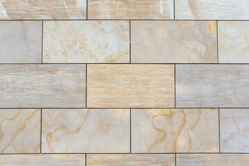 Background from a wall made of brown ceramic slabs