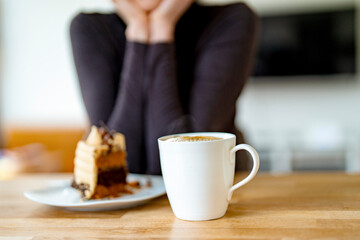 Enjoying Quiet Moment With Delicious Cake and Coffee in  Cozy Café Setting