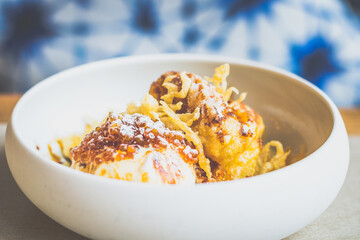 Tempura Banana.Batter fried banana, black sugar, gula melaka, coconut ice cream, sago.