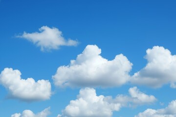 Obraz premium A Beautiful Day with Fluffy White Clouds in a Blue Sky