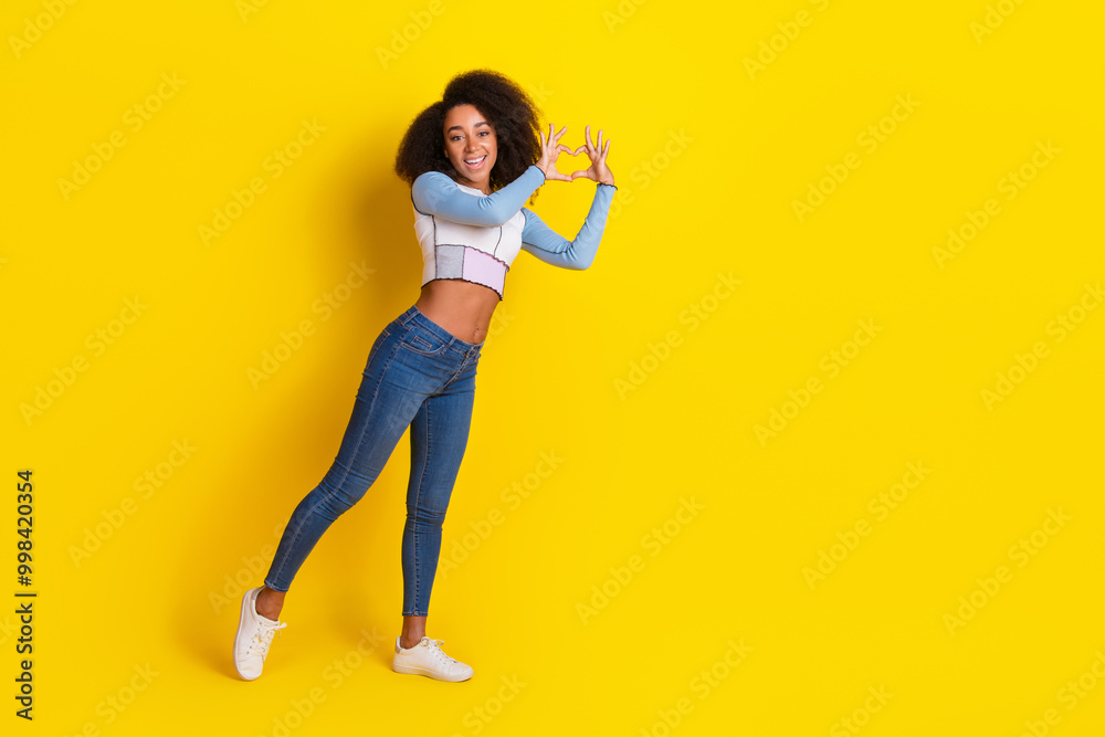 Canvas Prints Full size photo of nice good mood girl dressed stylish shirt jeans fingers showing heart symbol isolated on yellow color background