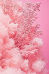 Fototapeta premium A dreamy image featuring delicate blurred pink flowers against a background of fluffy cotton-like textures.