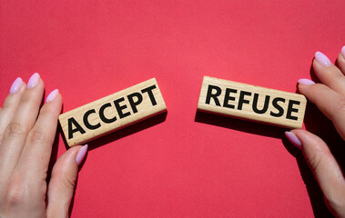 Accept or Reject symbol. Concept word Accept or Reject on wooden blocks. Businessman hand. Beautiful red background. Business and Accept or Reject concept. Copy space