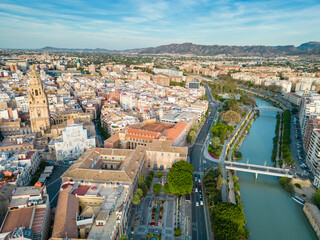 Obraz premium Aerial perspective of old town center of Murcia. Rooftops of Murcia. Medieval and historic travel destination in Spain. View of Cathedral of Murcia. River Segura 