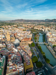 Aerial perspective of old town center of Murcia. Rooftops of Murcia. Medieval and historic travel destination in Spain. View of Cathedral of Murcia. River Segura 