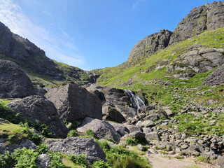 Obraz premium Rocks, hills and waterfall in Ireland, natural landscape background