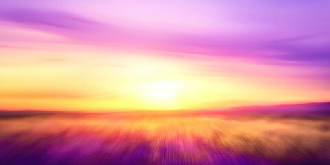 A blurry image of a field with a sun in the sky